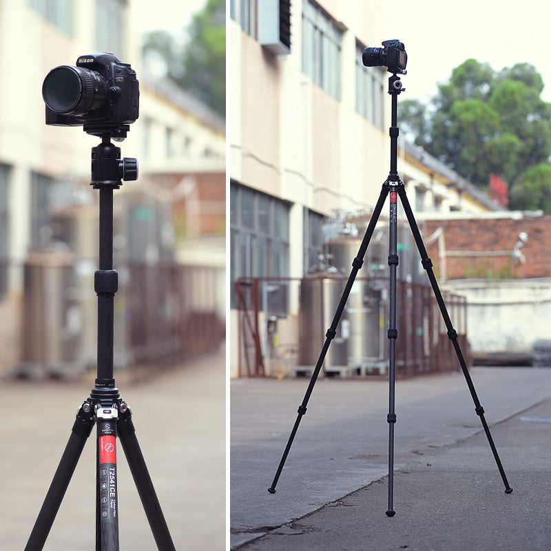Camera and tripod setups alongside an architectural facade